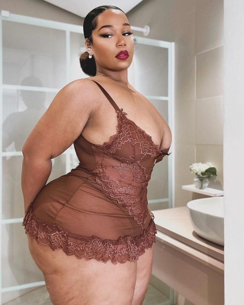 Curvy model strips to lingerie – but fans hit back at trolls for 'fat shaming'