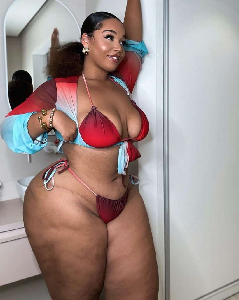 Curvy model strips to lingerie – but fans hit back at trolls for 'fat shaming'