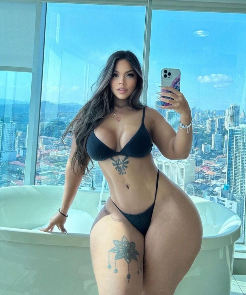 Model shows off curvy bum after moaning it's 'too big to fit in plane seats'