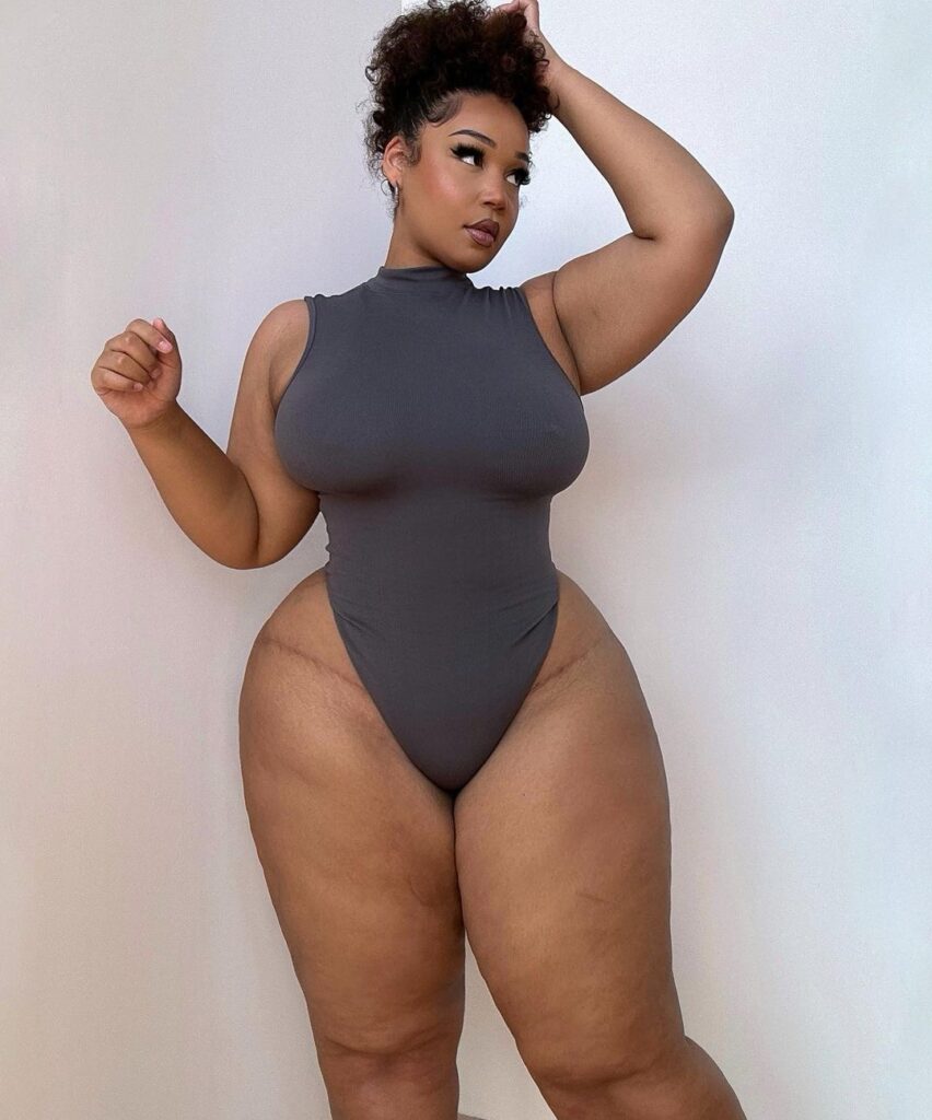 Curvy model strips to lingerie – but fans hit back at trolls for 'fat shaming'