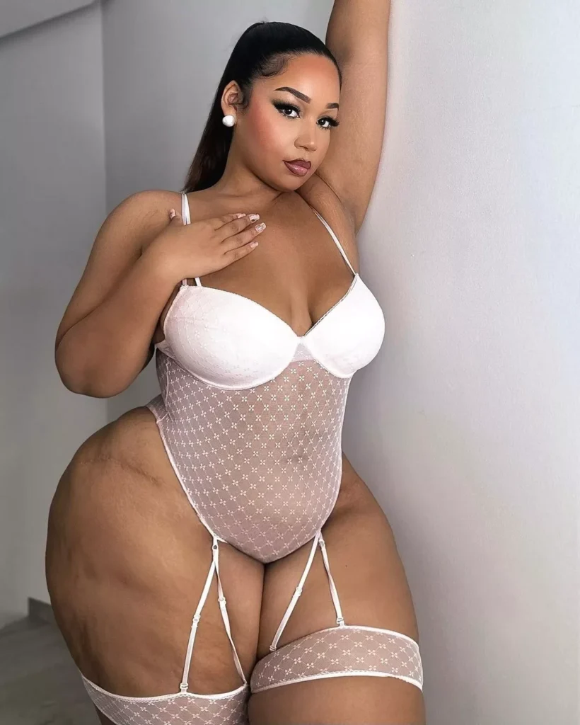 Curvy model strips to lingerie – but fans hit back at trolls for 'fat shaming'