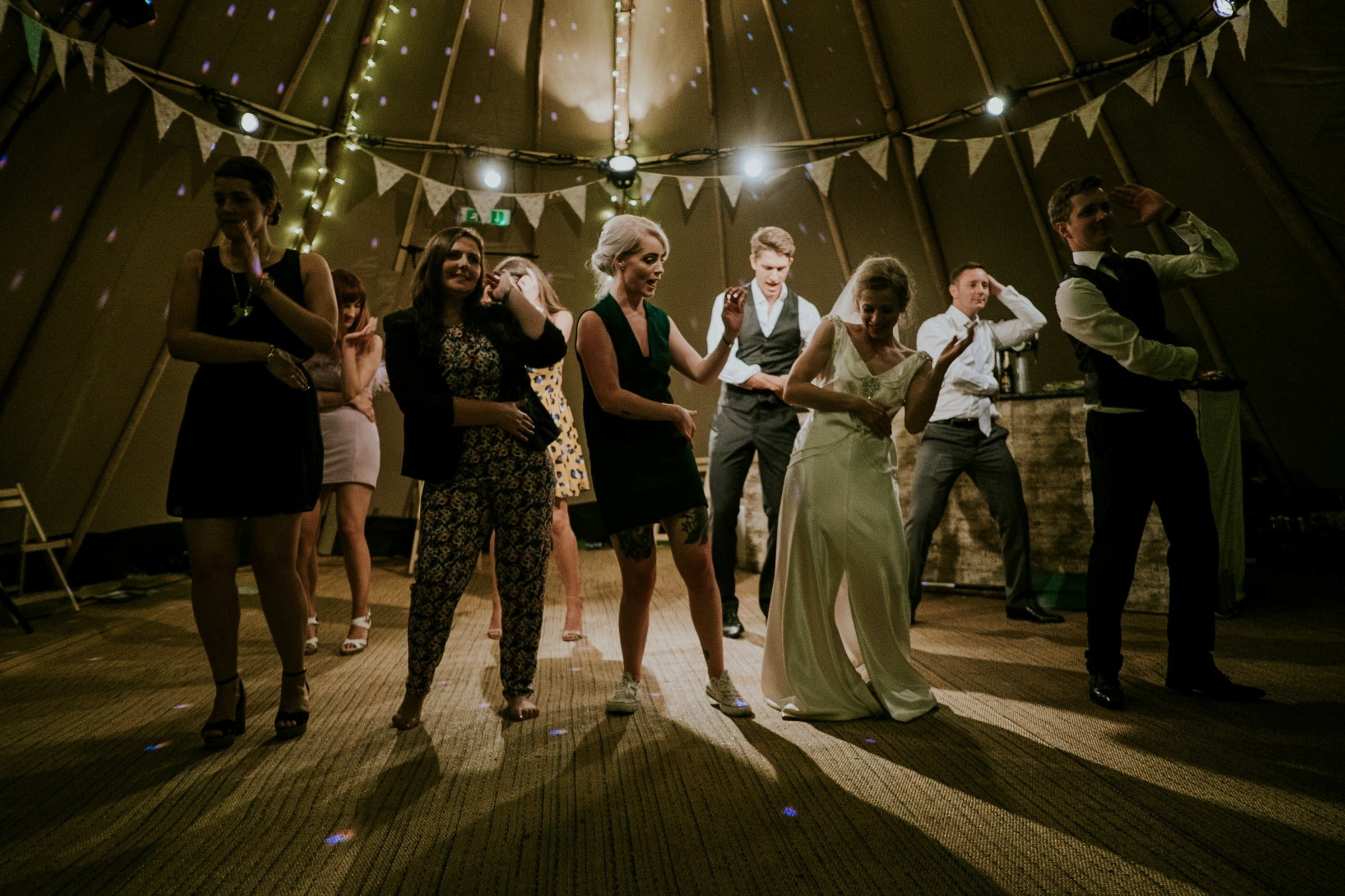 Dancing people at a wedding | Source: Unsplash