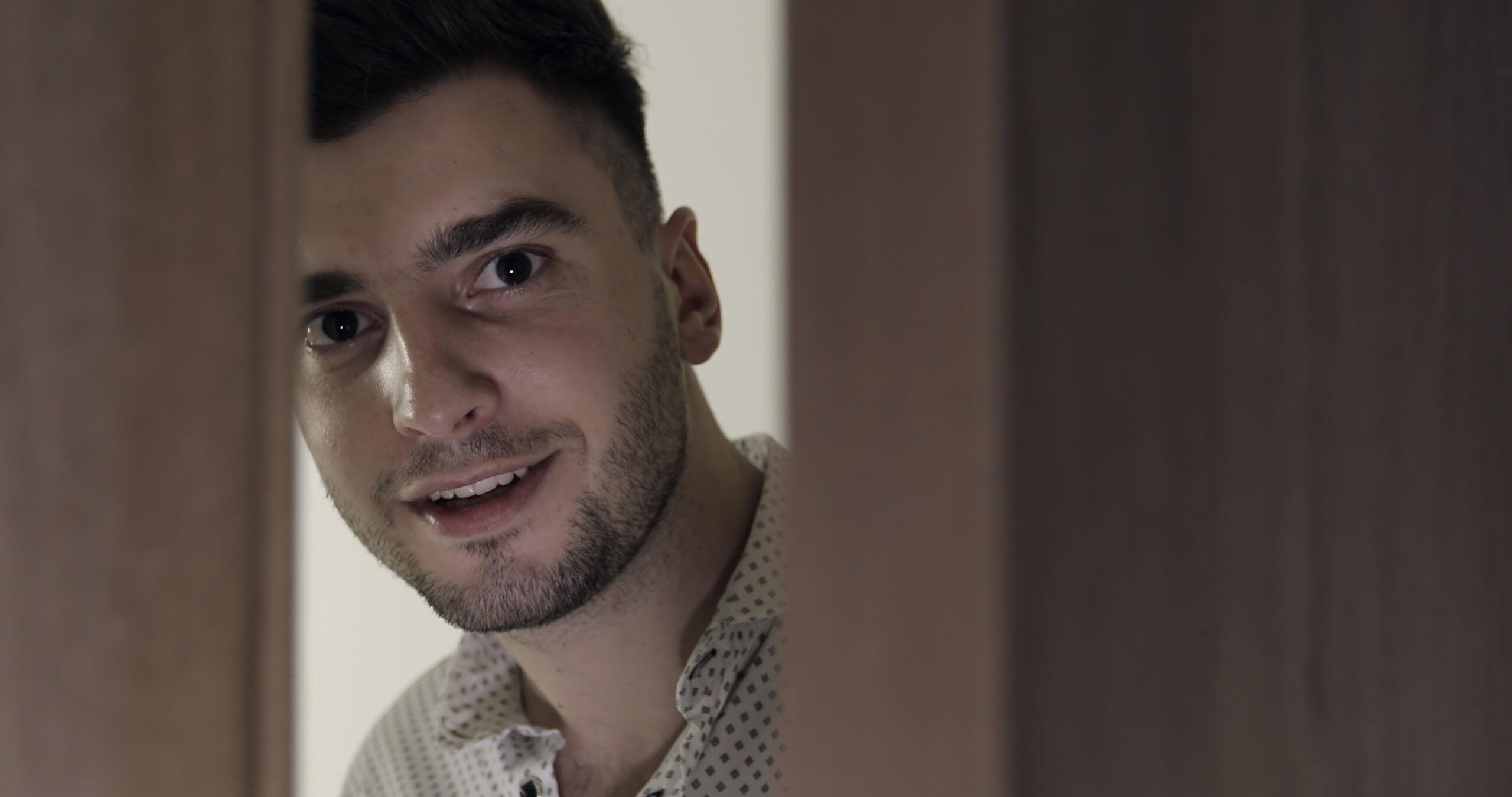 A young man at the door | Source: Shutterstock