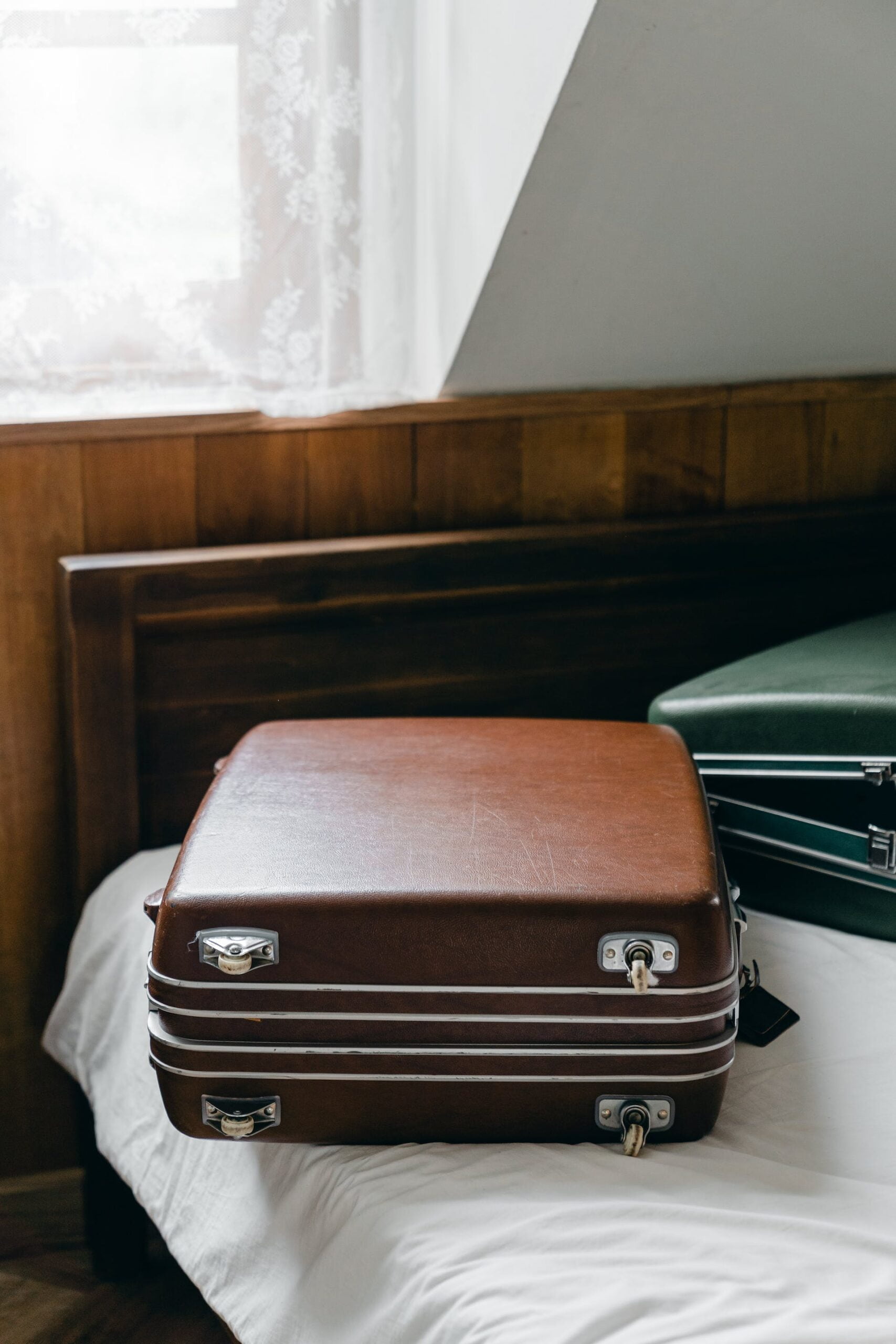 Suitcases on a bed | Source: Pexels